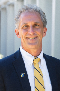 Portrait of Lane standing outside at the NECC Campus