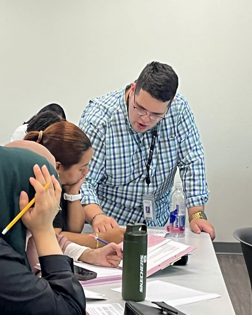 NECC ESOL instructor Gregory Blomgren helping a student