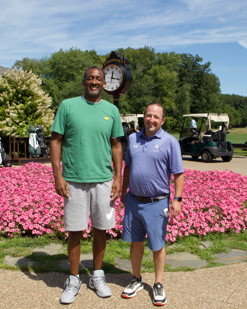 coach jimmy and dan blair pose smiling at camera