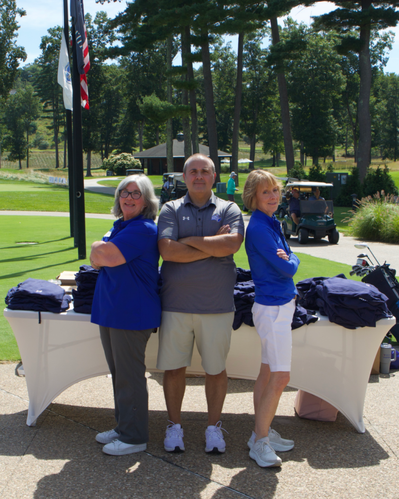 two academic coaches stand back-to-back with coach darren stratton
