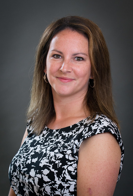 jody posed slightly angled toward the camera, smiling over her left shoulder