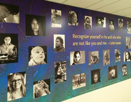 a new mural "Diversity" hangs from a wall in the Dimitry Building on the Lawrence Campus.
