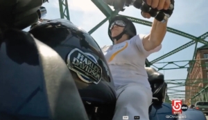 Screenshot of Andrea Vannett from the broadcast on her bike