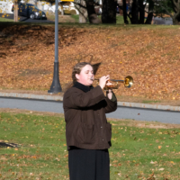 student plays the bugle
