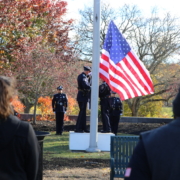 police officers raise flag