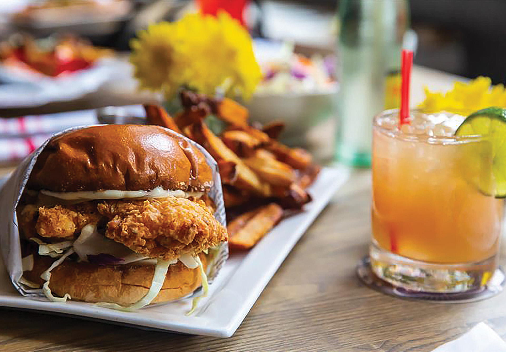 The Corpus Crispy Chicken Sandwich with a drink