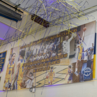 championship banner shows a team picture with words "national champions" across the middle