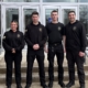 four student officers stand side by side smiling at the camera
