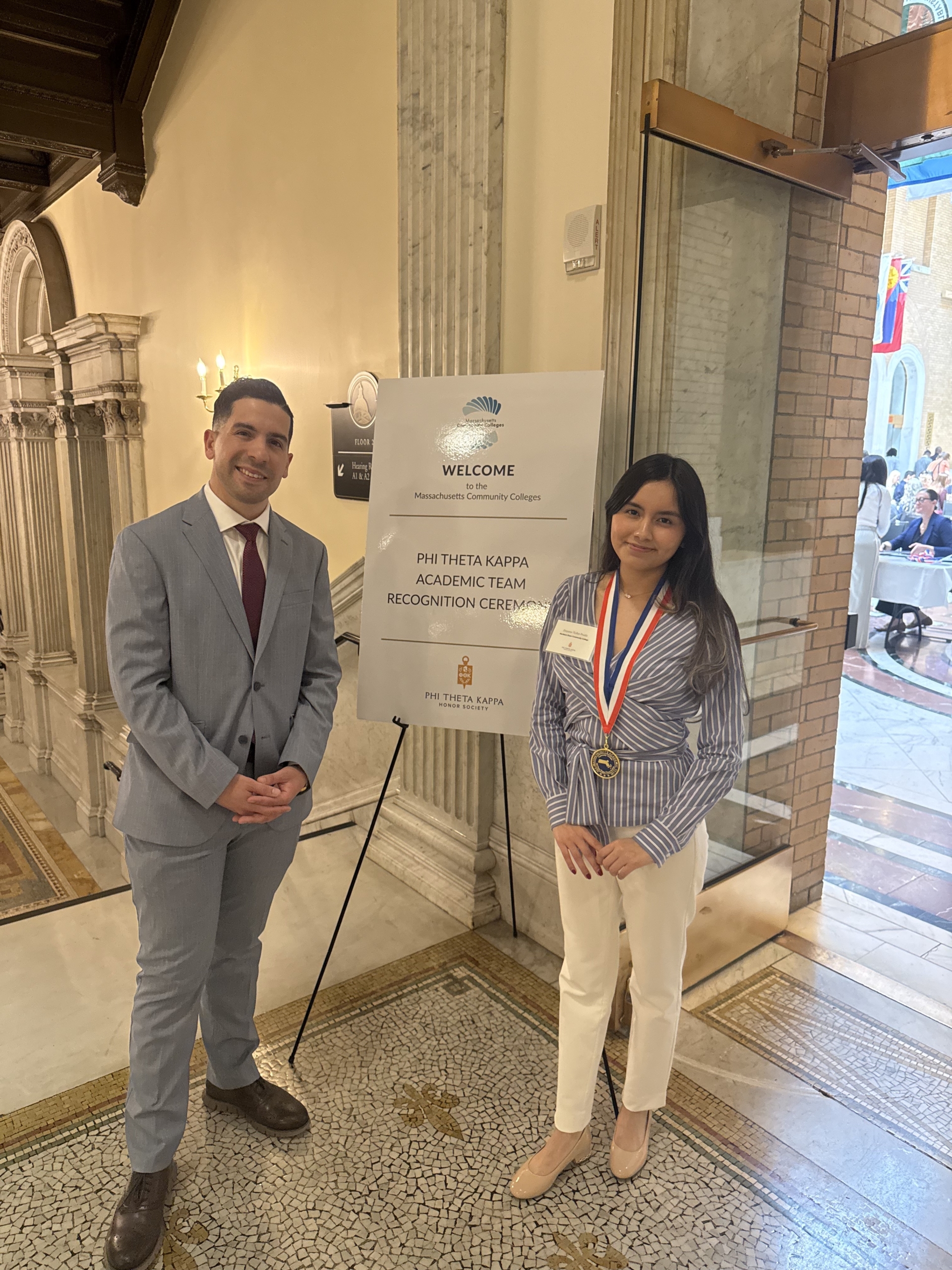 Andy Vargas stands with Dayana at the state house