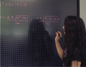 A student using a smart board
