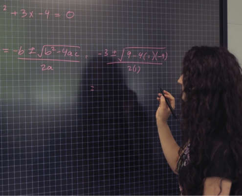 A student using a smart board