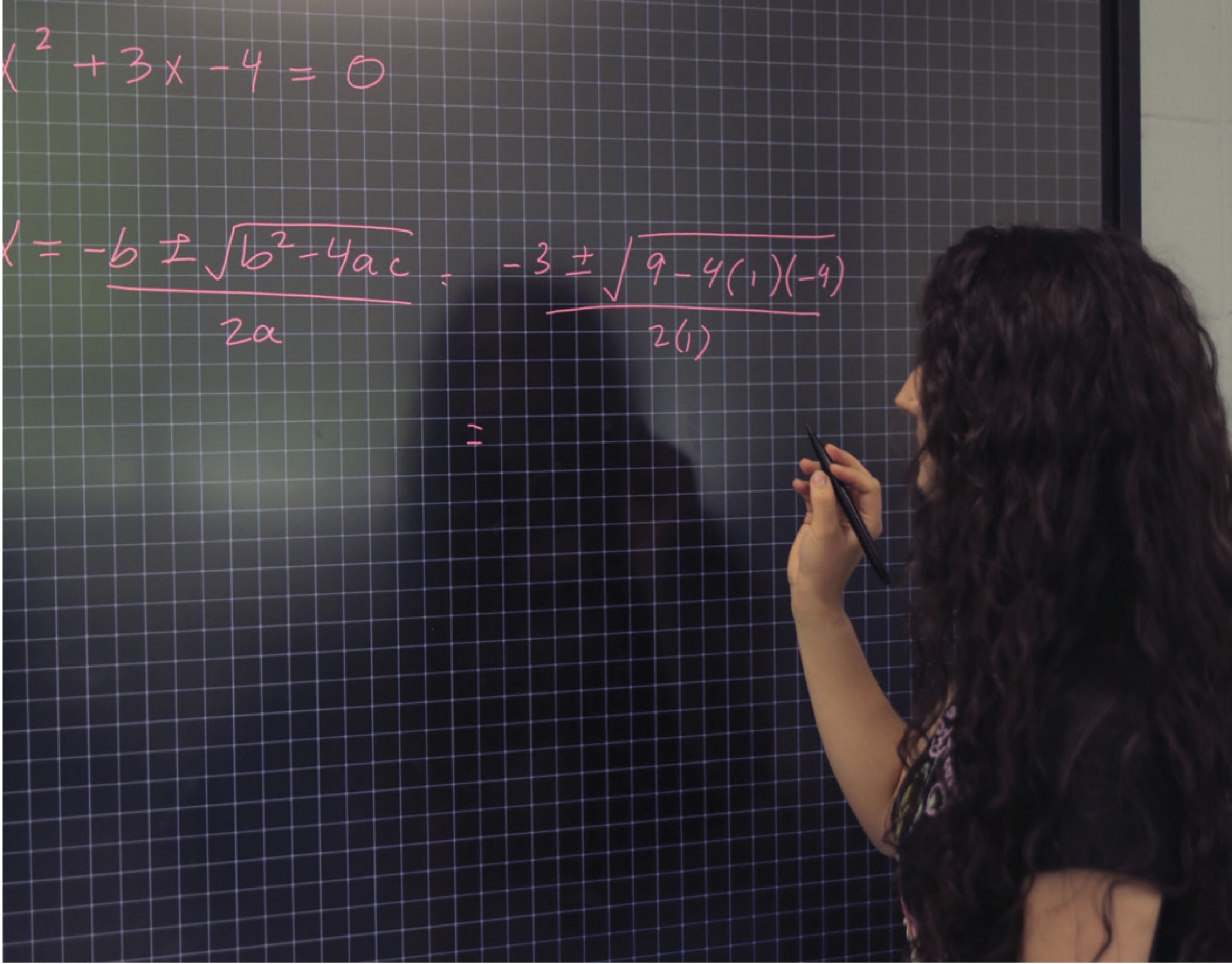 A student using a smart board