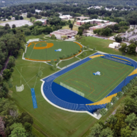 rendering of the new athletic field complex with bright blue track on the foreground and the baseball field behind it to the left