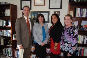 NECC President Lane Glenn with employee recognition award winners Julie Carey, Ingrid Polanco, and Maria Hom.