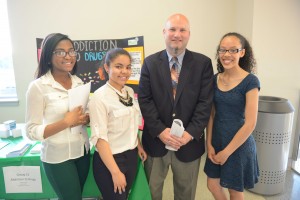 Lawrence Superintendent Jeff Riley with students (left to right) Wildaly Santana, Aysha Polanco, and Anabeliz Brito.