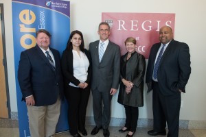 left to right, NECC Nursing graduates Christopher Guard and Jennifer Nunez, who are both continuing for bachelors in nursing at Regis North, NECC President Lane Glenn, Regis President Toni Hays, and Lawrence Mayor Dan Rivera.
