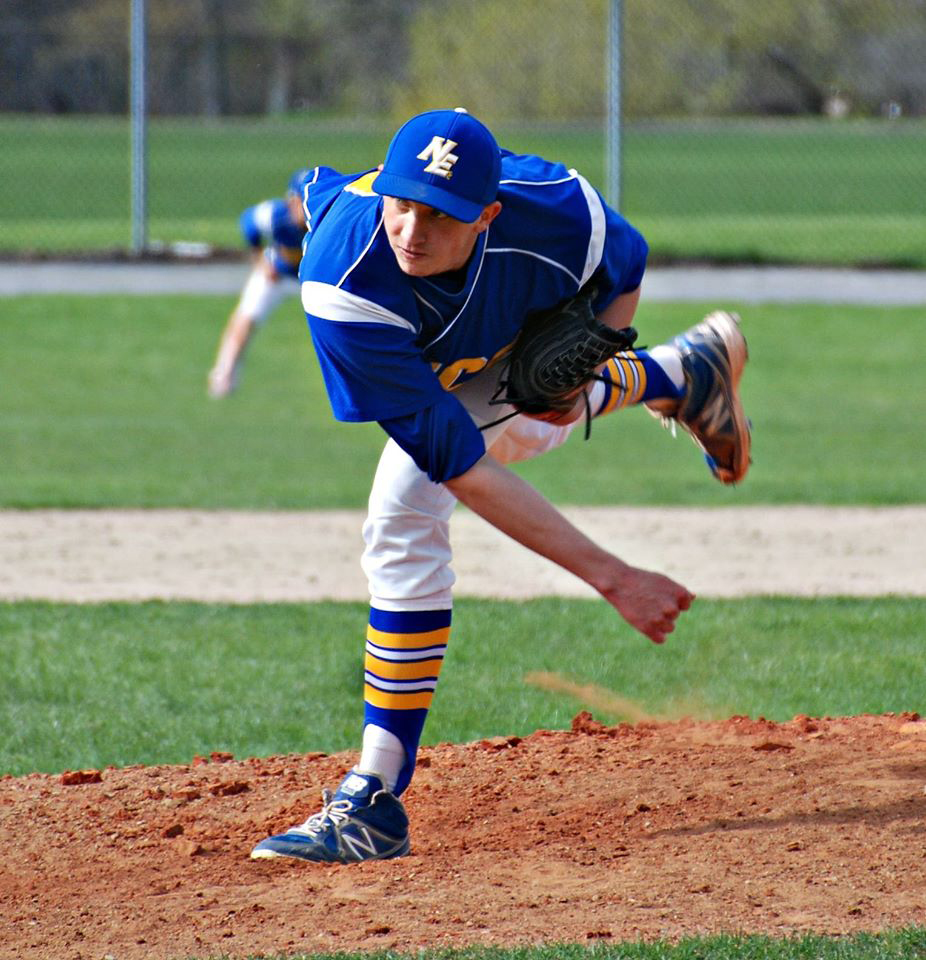 Ryan in necc knights uniform having just thrown a pitch
