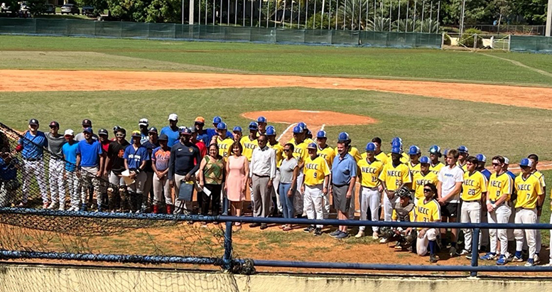 NECC baseball team posing with family and friends in the DR
