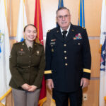 two veterans pose for photo