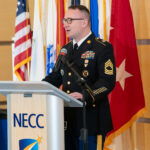 veterans services coordinator stands at podium