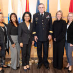 group gathers for shot