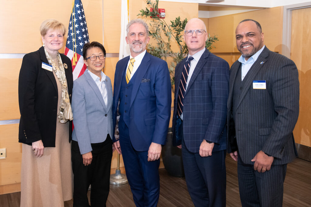 Trustee Jen Borisolow, chen, glenn, keenan and trustee jouel gomez stand smiling at the camera