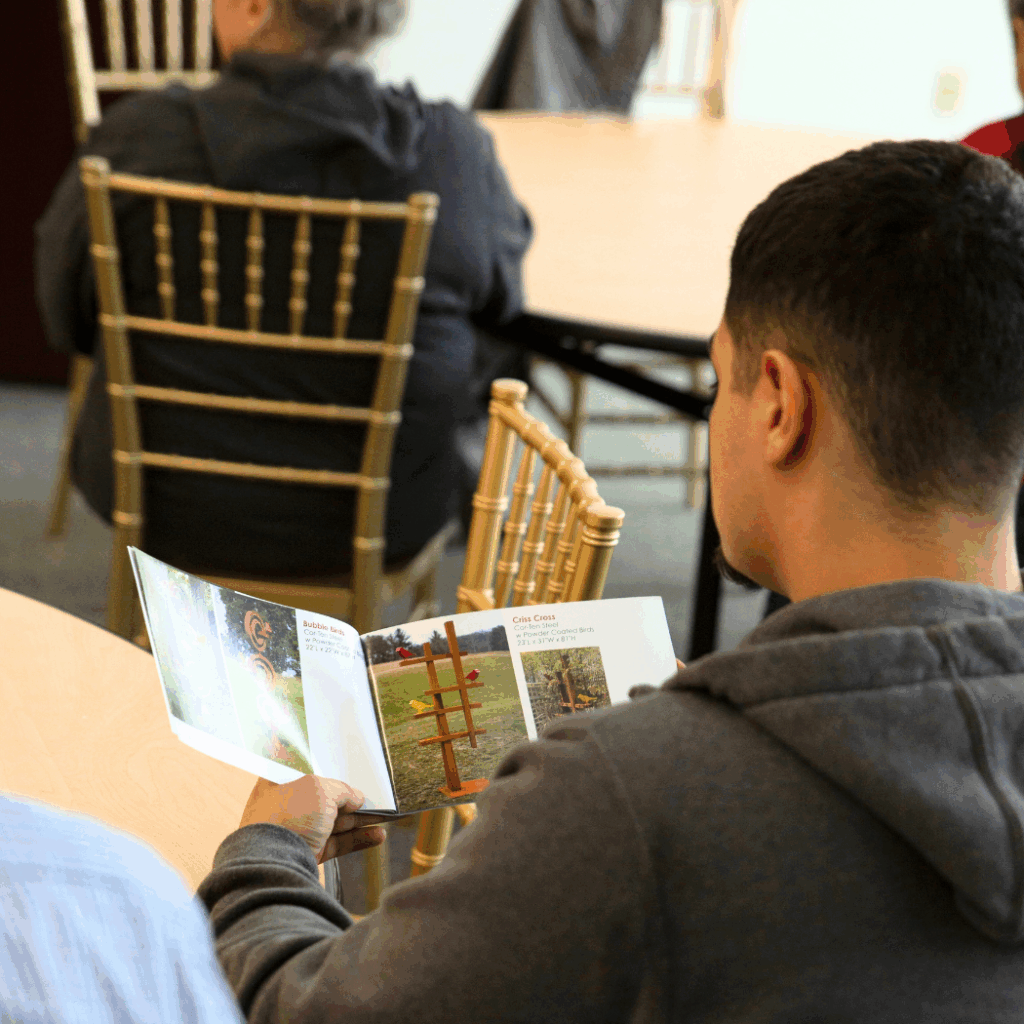 shot over the shoulder of a student looking at Dale's catologue