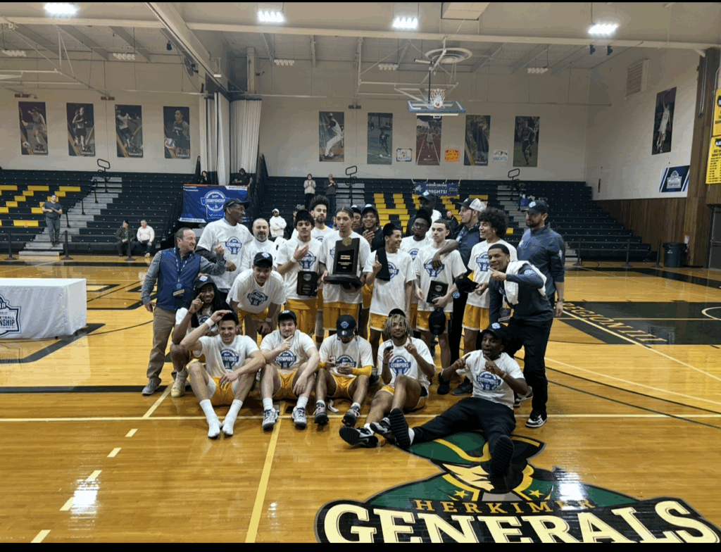 team poses together with championship trophy, many hold up their fingers to indicate number 1