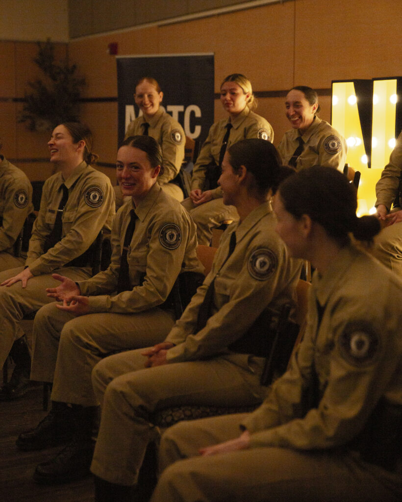 student officers sit together and laugh