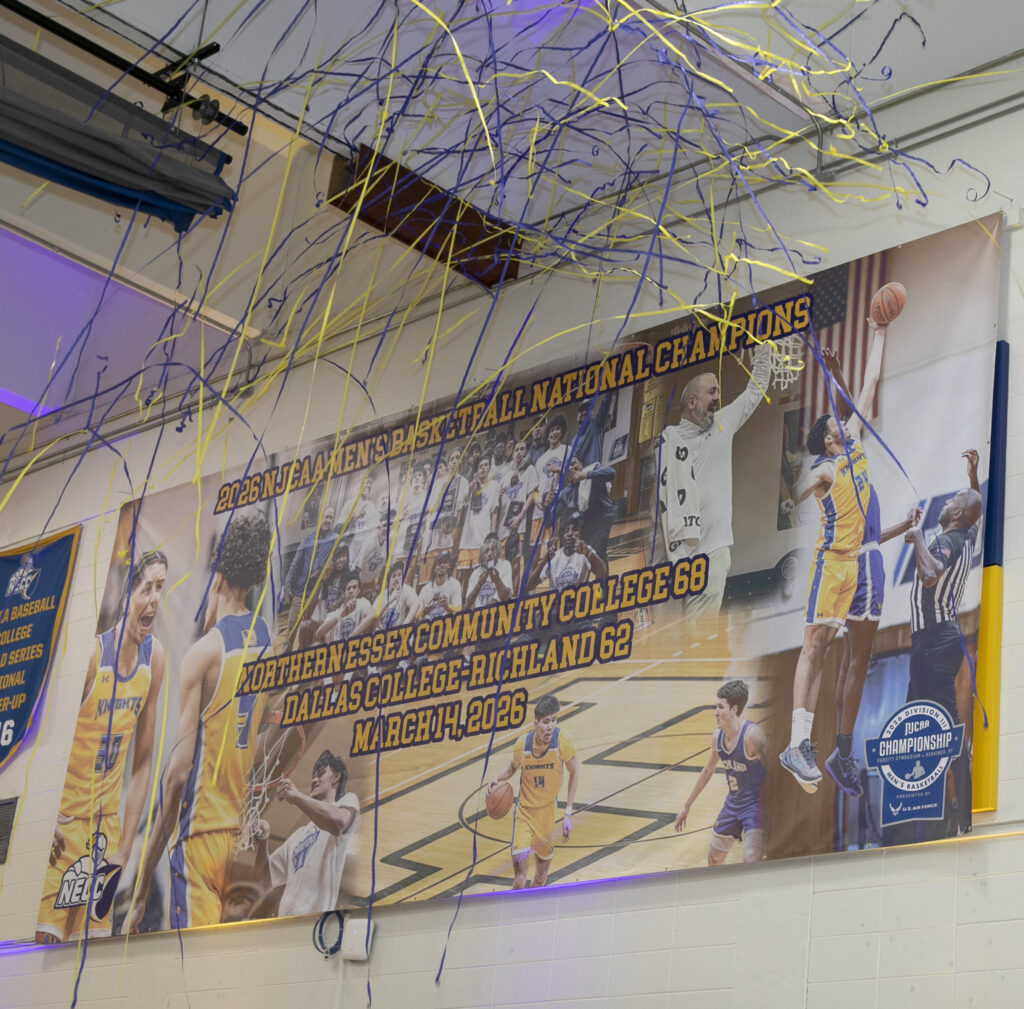championship banner shows a team picture with words "national champions" across the middle
