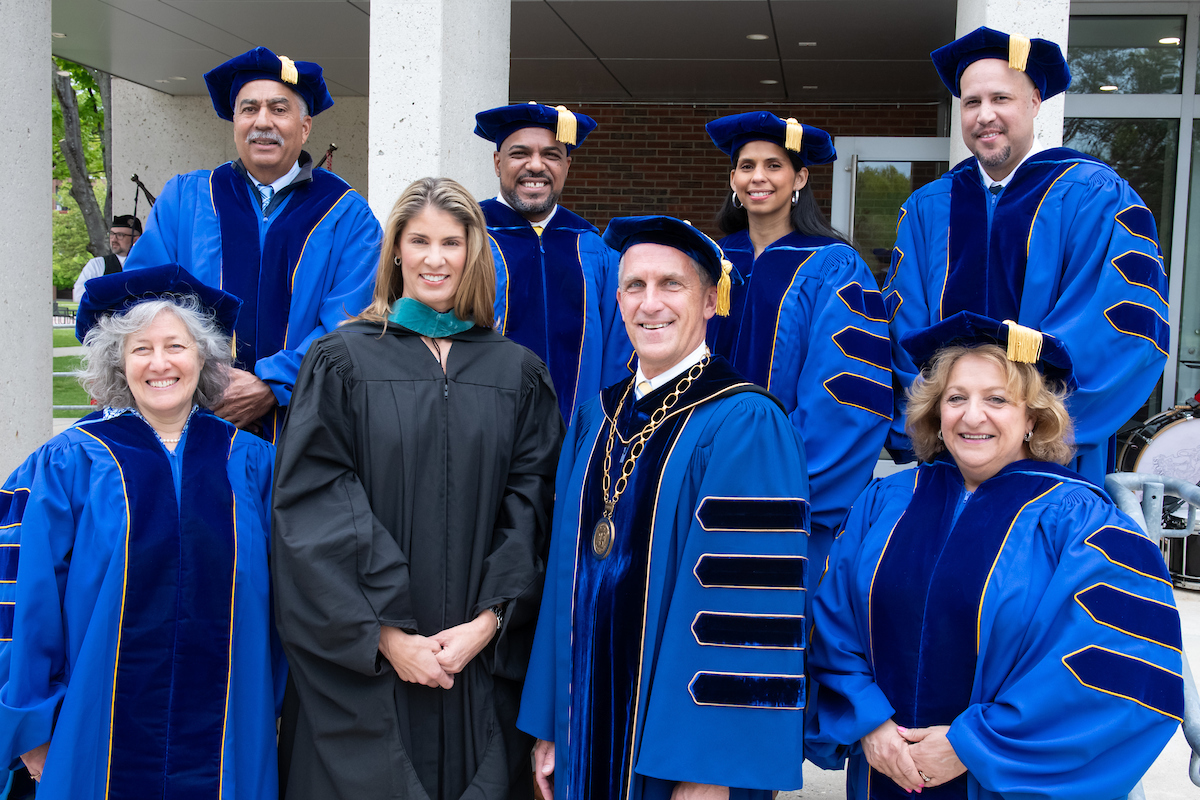 PHOTO: President Lane Glenn and members of the NECC Board of Trustees pose with Congresswoman Lori Trahan at Commencement