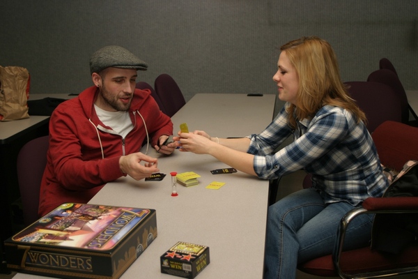 Steven Edwards and Angela Bowie playing a board game at an NECC Bacon Board Gamers event.